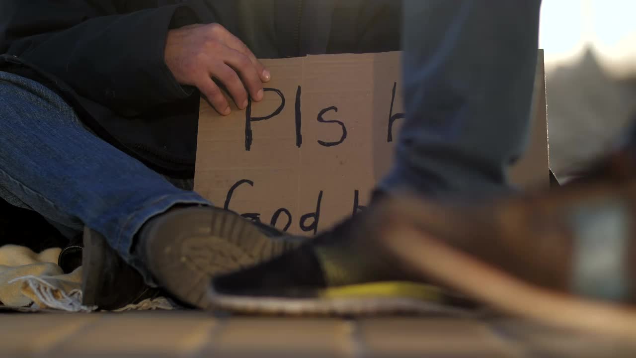 Video Stock Cardboard Sign Of A Homeless Man On The Street Live Wallpaper For PC