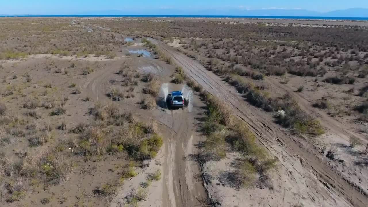 Video Stock Car Passing Through A Puddle In The Plain Live Wallpaper For PC