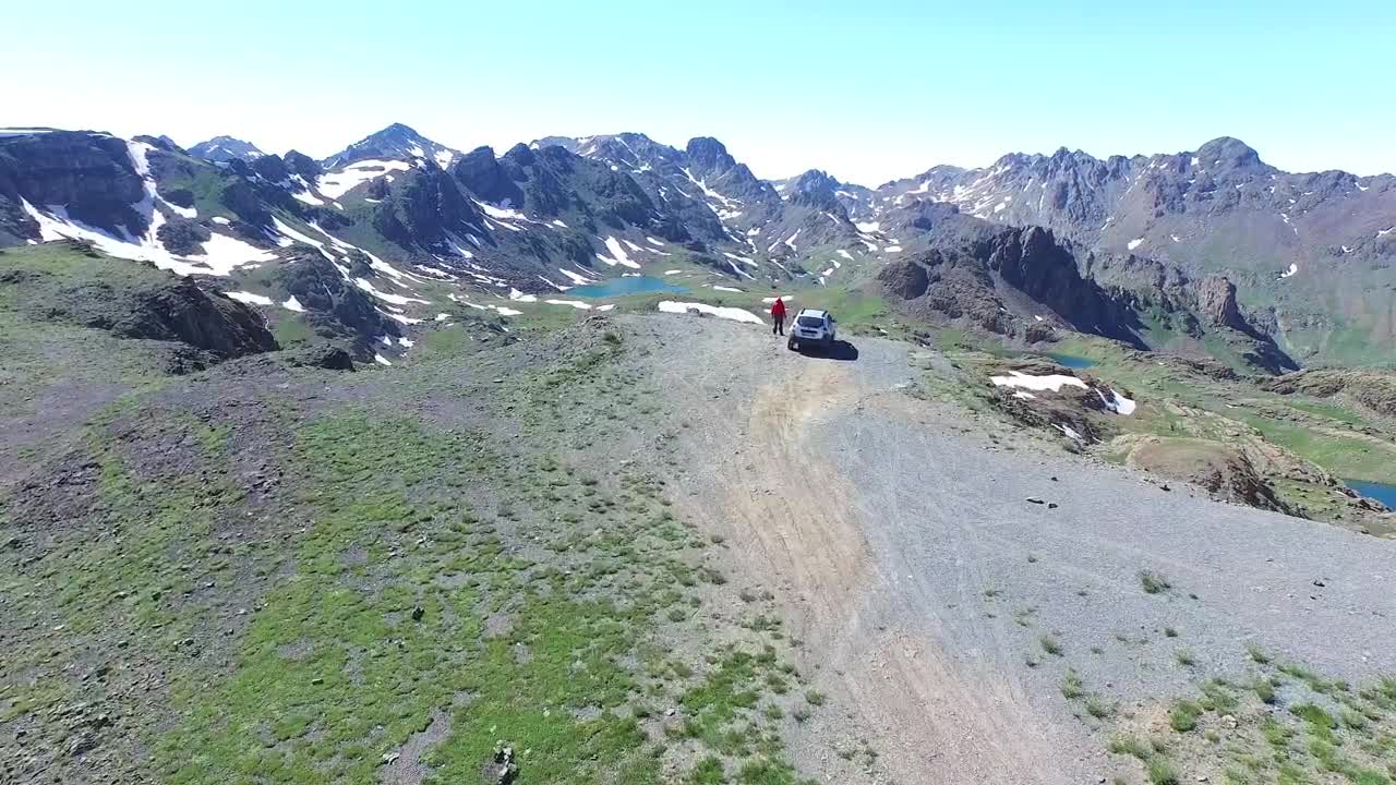 Video Stock Car And Man On A Mountain Peak Looking To The Live Wallpaper For PC