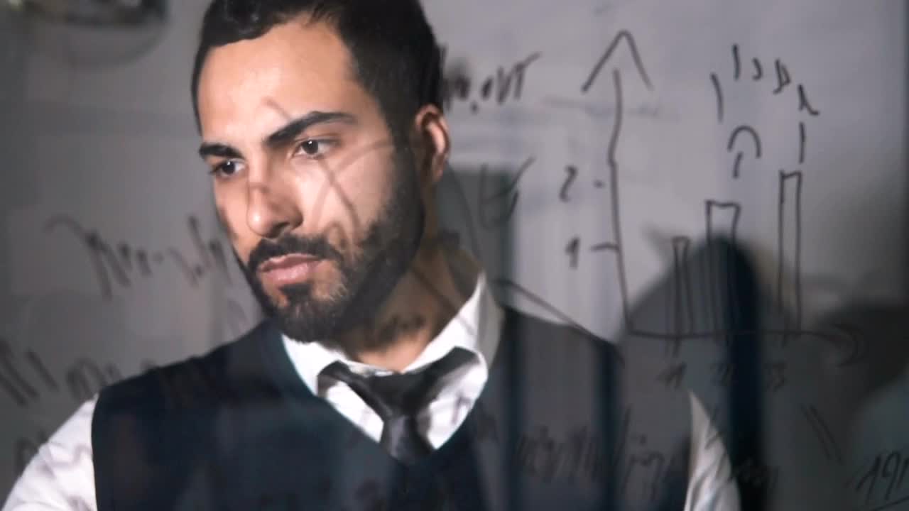 Video Stock Businessman Thinks Up Solution With Writing On Glass Live Wallpaper For PC