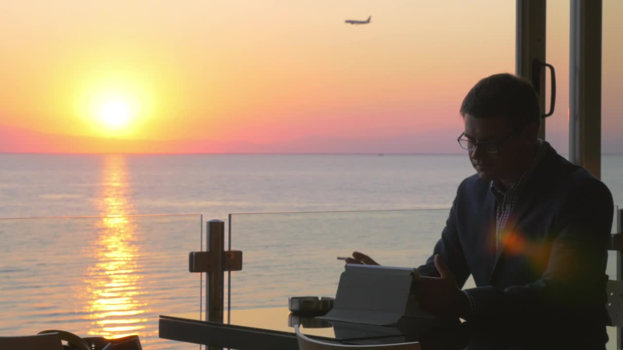 Video Stock Businessman Smoking And Looking At A Plane Live Wallpaper For PC