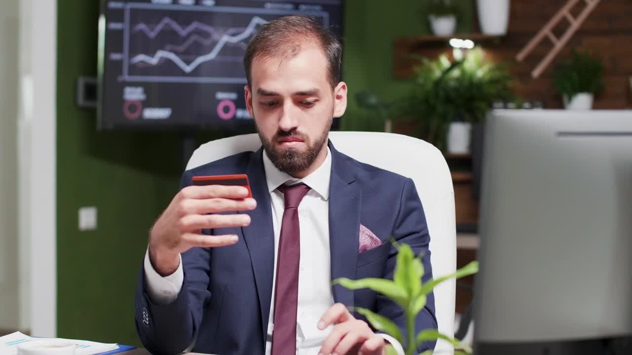 Video Stock Businessman Online Shopping In Office Holds Credit Card Live Wallpaper For PC