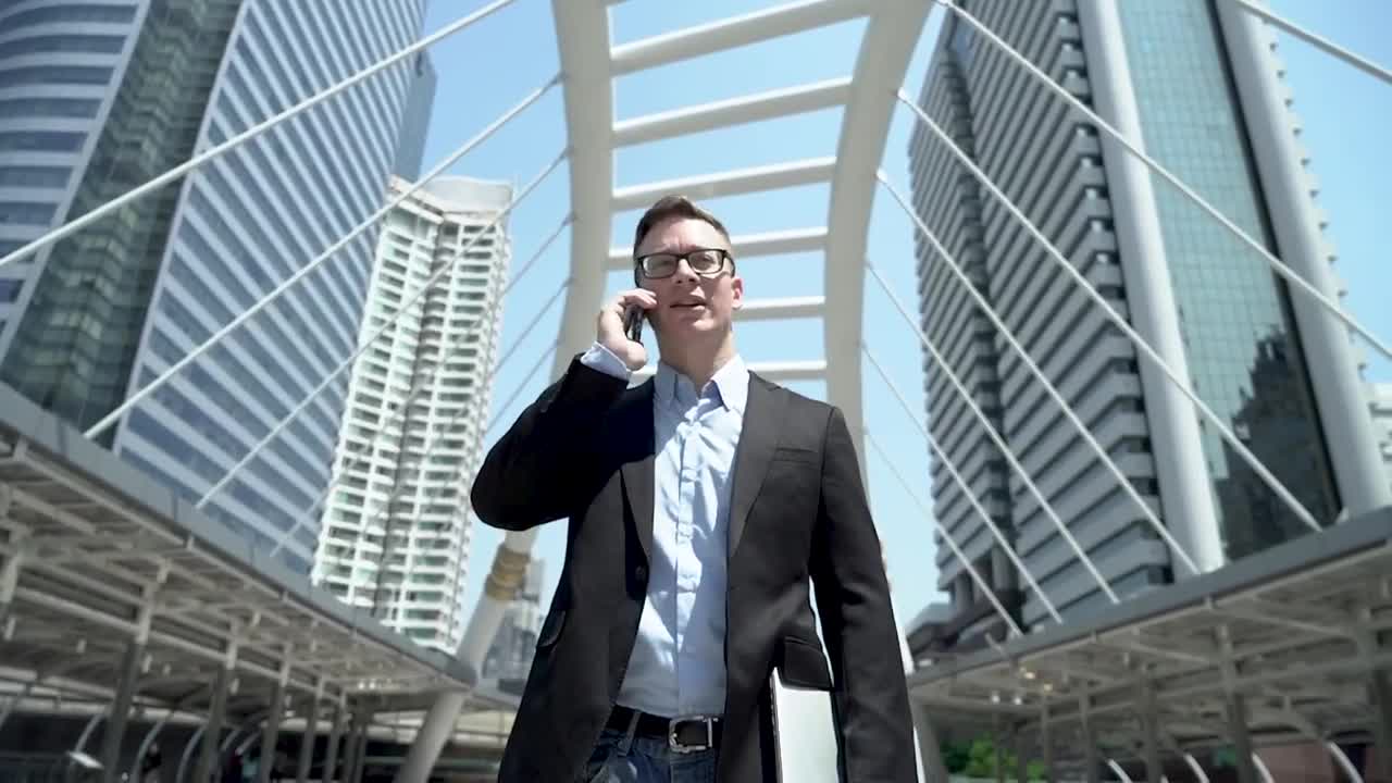 Video Stock Businessman On A Call On The Street Live Wallpaper For PC