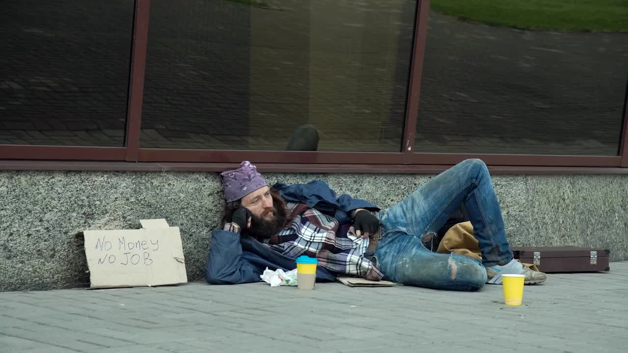 Video Stock Businessman Giving Money To Homeless Man Live Wallpaper For PC