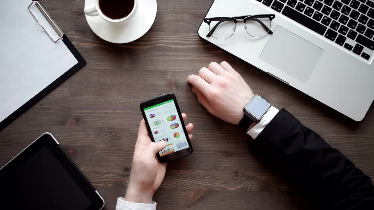 Video Stock Businessman Checking Data On His Mobile Phone Live Wallpaper For PC