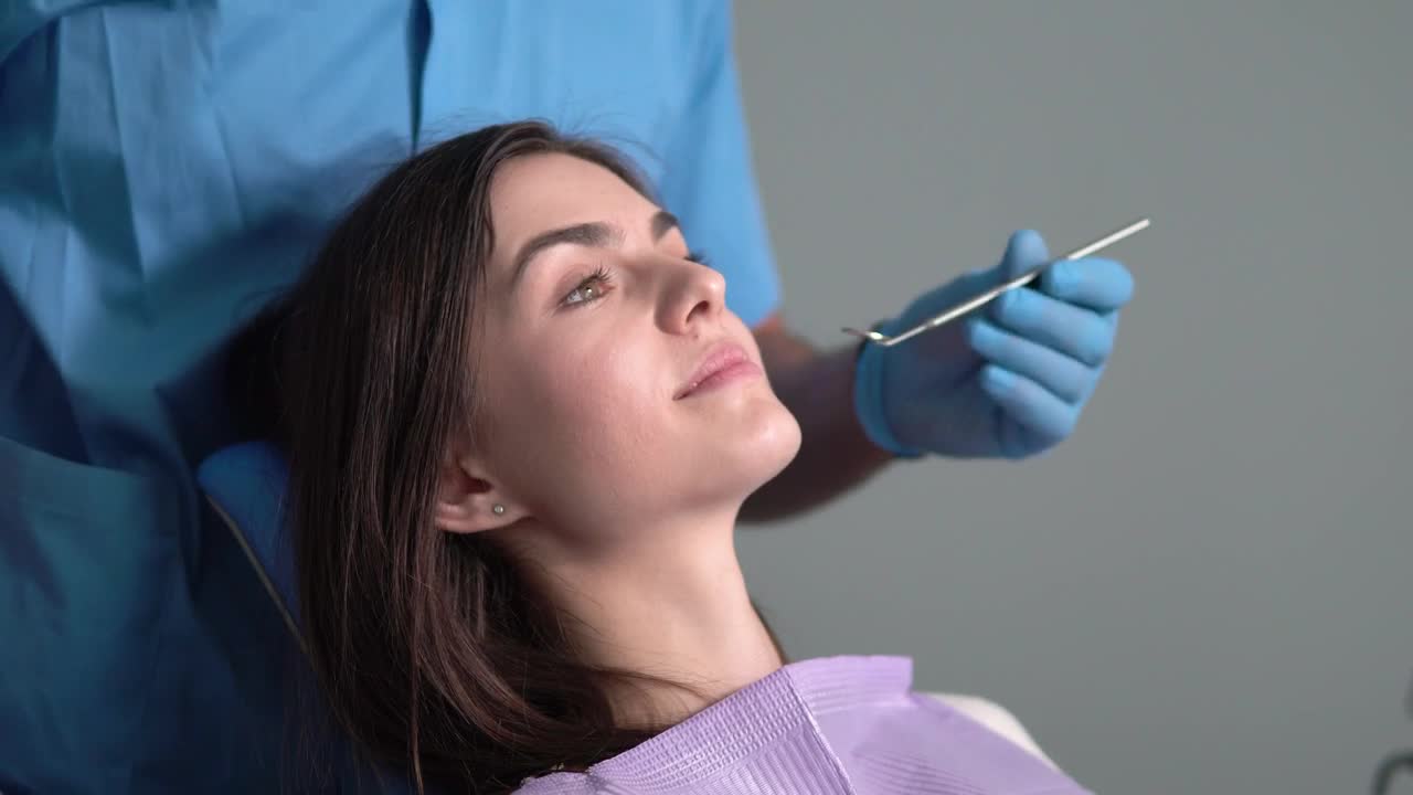 Stock Video Dentist Uses Mirror To Check Patient Teeth Live Wallpaper For PC