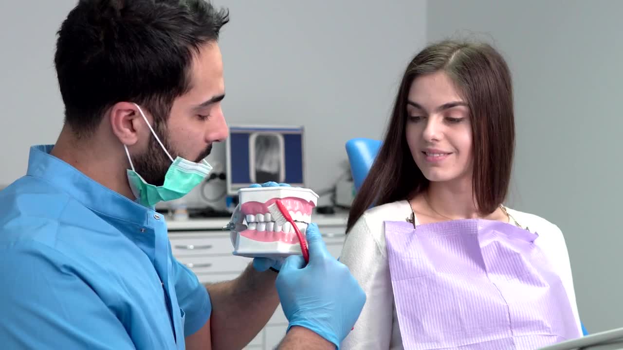 Stock Video Dentist Shows Woman Proper Teeth Brushing Live Wallpaper For PC