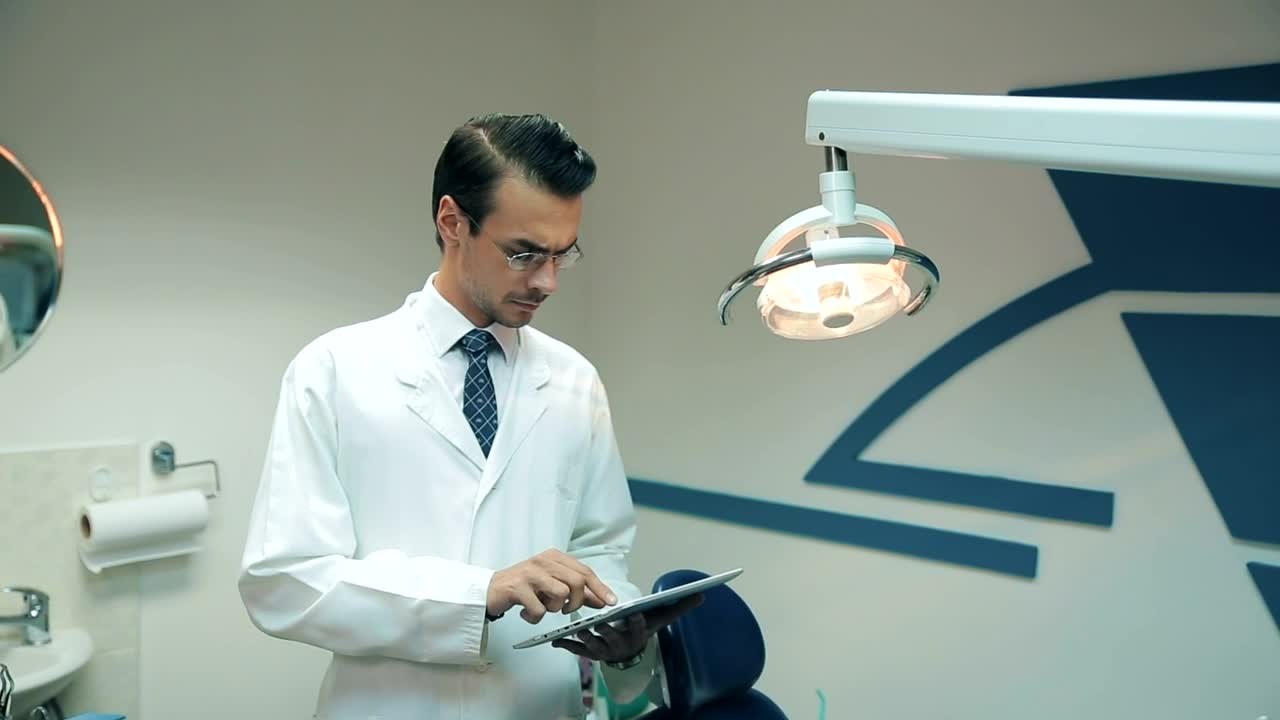 Stock Video Dentist Reviewing Data On His Tablet Live Wallpaper For PC