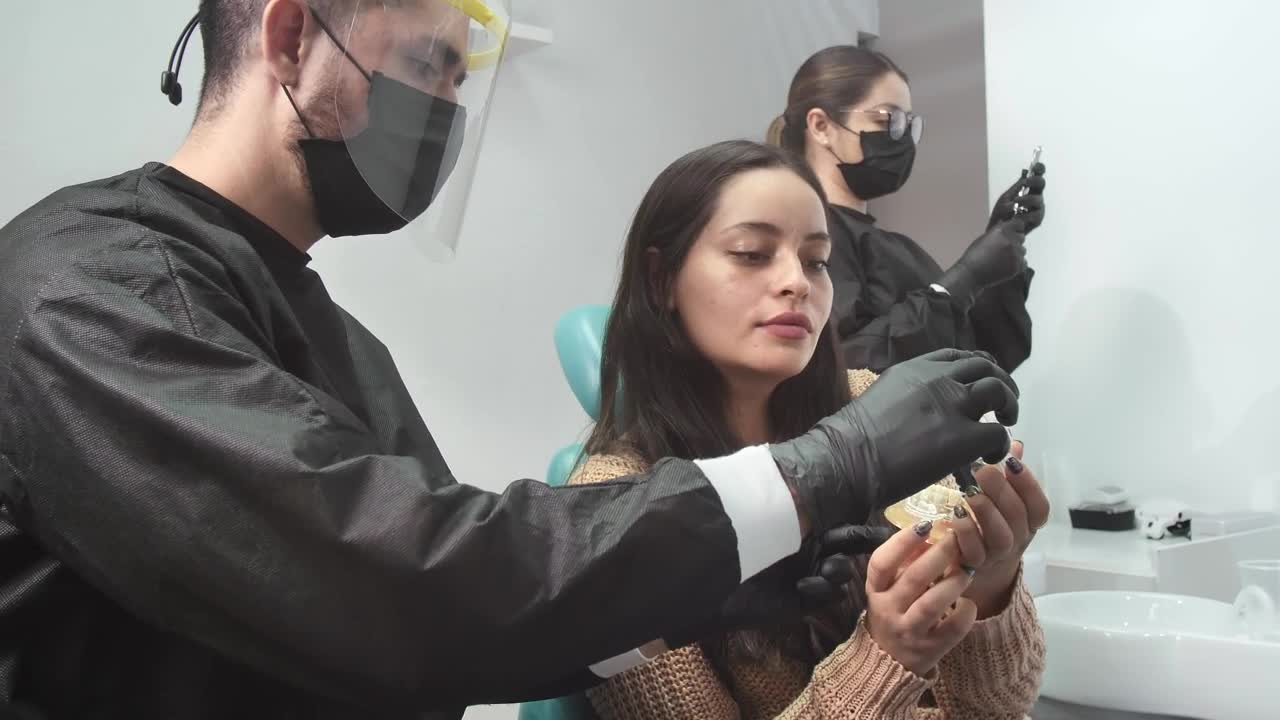 Stock Video Dentist Explaining A Denture To His Patient Live Wallpaper For PC