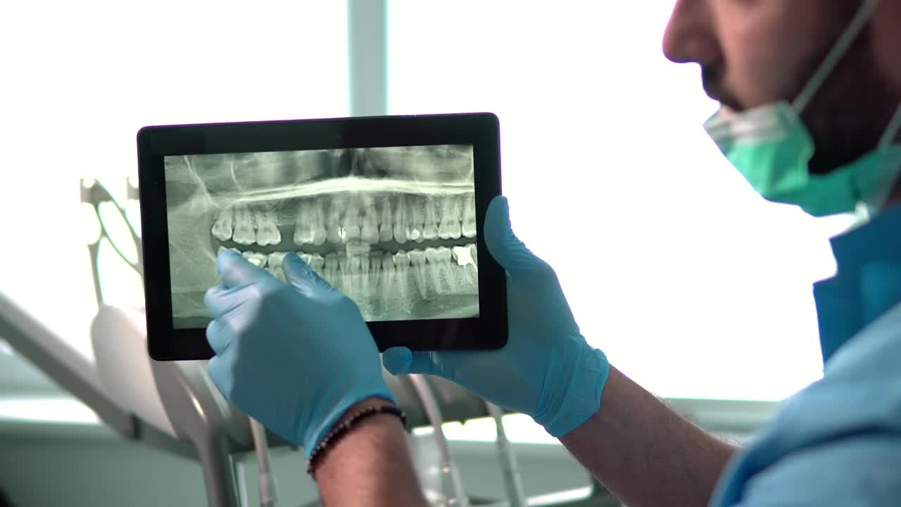 Stock Video Dental Nurse Explains Teeth X Ray On Tablet Live Wallpaper For PC