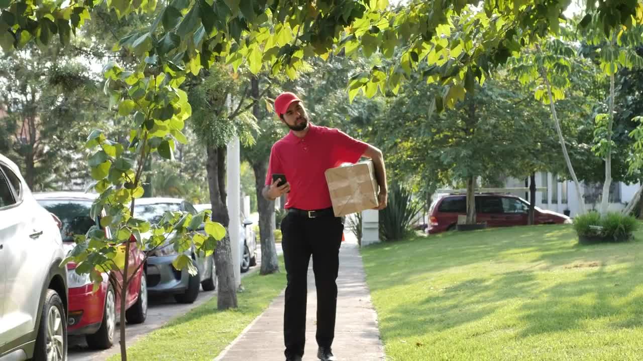 Stock Video Delivery Man Looking For An Address On The Street Live Wallpaper For PC