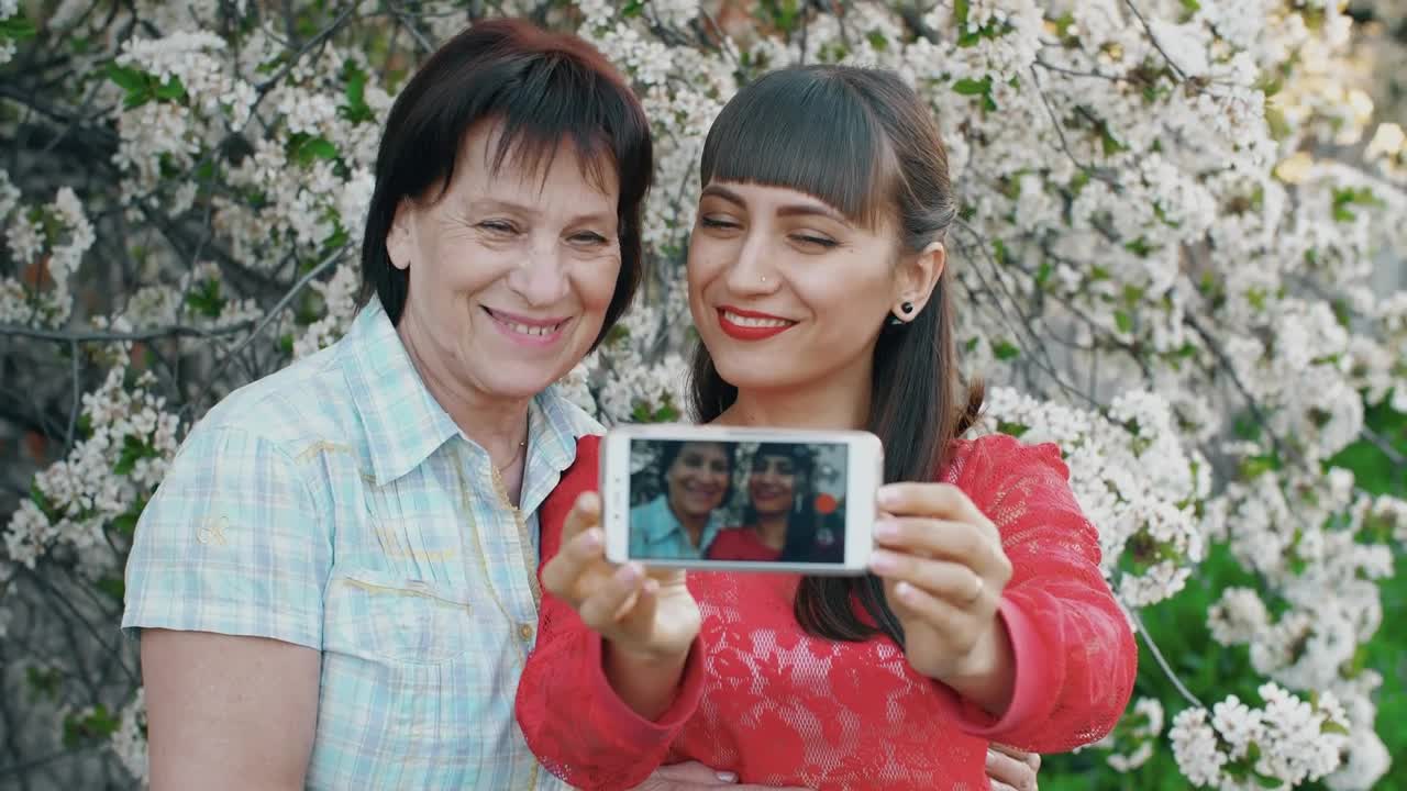 Stock Video Daughter Takes A Selfie With Her Mother Live Wallpaper For PC