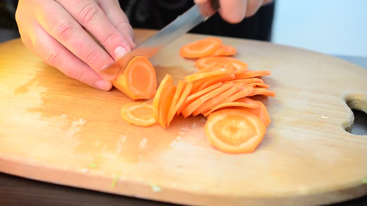Stock Video Cutting Up Carrots On A Chopping Board Live Wallpaper For PC