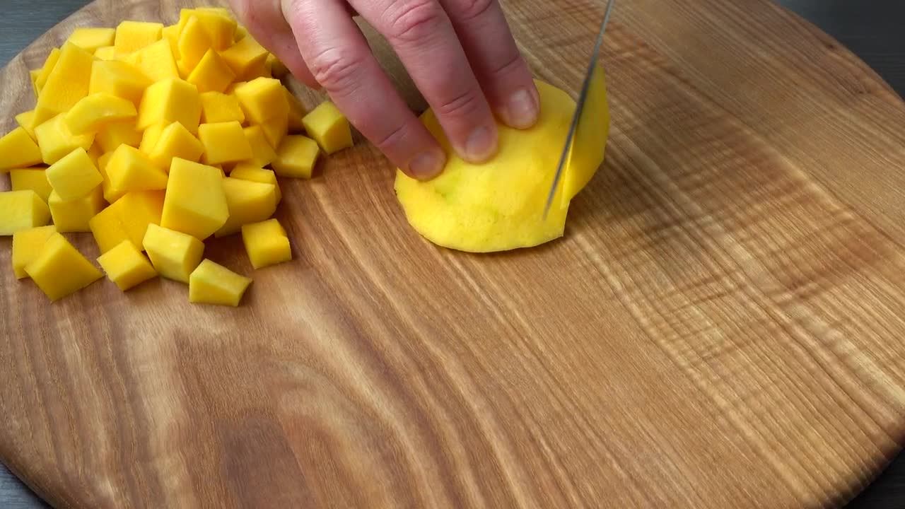 Stock Video Cutting Mango Cubes On A Board Live Wallpaper For PC