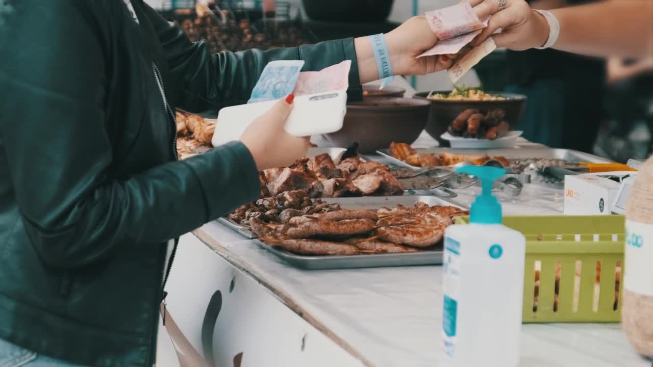 Stock Video Customer Buying Grilled Meat At The Market Live Wallpaper For PC