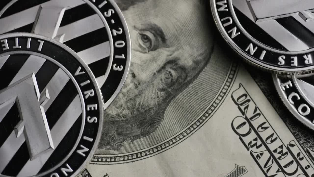 Stock Video Cryptocurrency Lite Coins Over Dollar Bills Live Wallpaper For PC