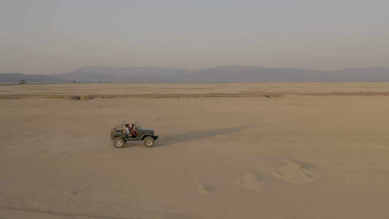 Stock Video Crossing A Desert By Truck At Sunset Live Wallpaper For PC