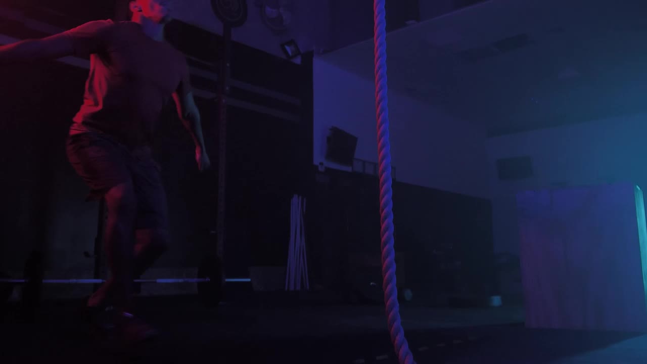 Stock Video Crossfit Man While Training Climbing A Rope Live Wallpaper For PC