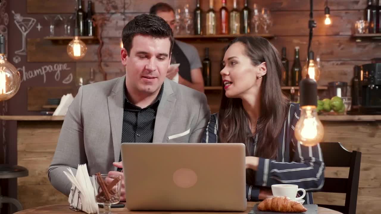 Stock Video Creative Woman Explains Idea To Client In Hip Cafe Live Wallpaper For PC