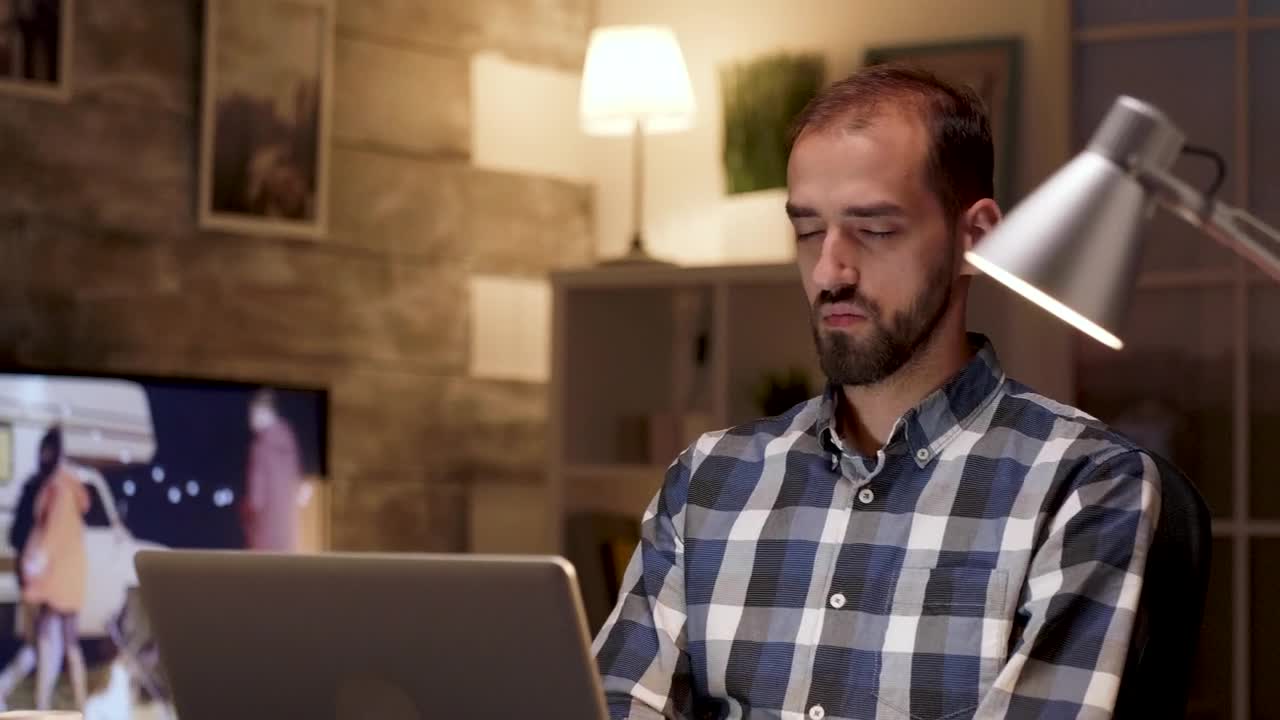 Stock Video Creative Man Stops To Think While Working On Laptop Live Wallpaper For PC