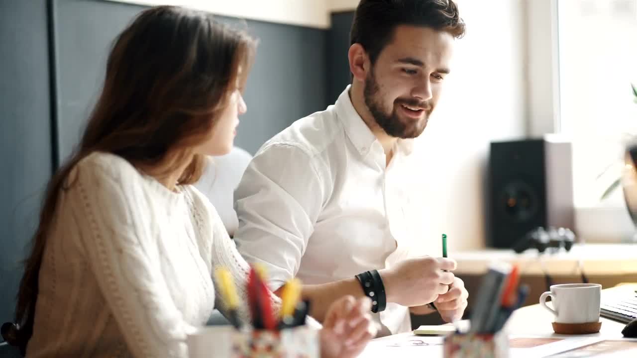 Stock Video Coworkers Working Together On A Design Project Live Wallpaper For PC