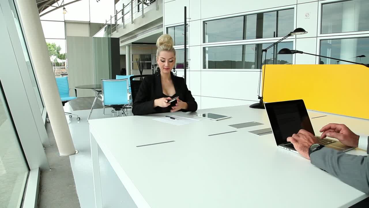 Stock Video Coworkers Sharing Desk At Office Live Wallpaper For PC