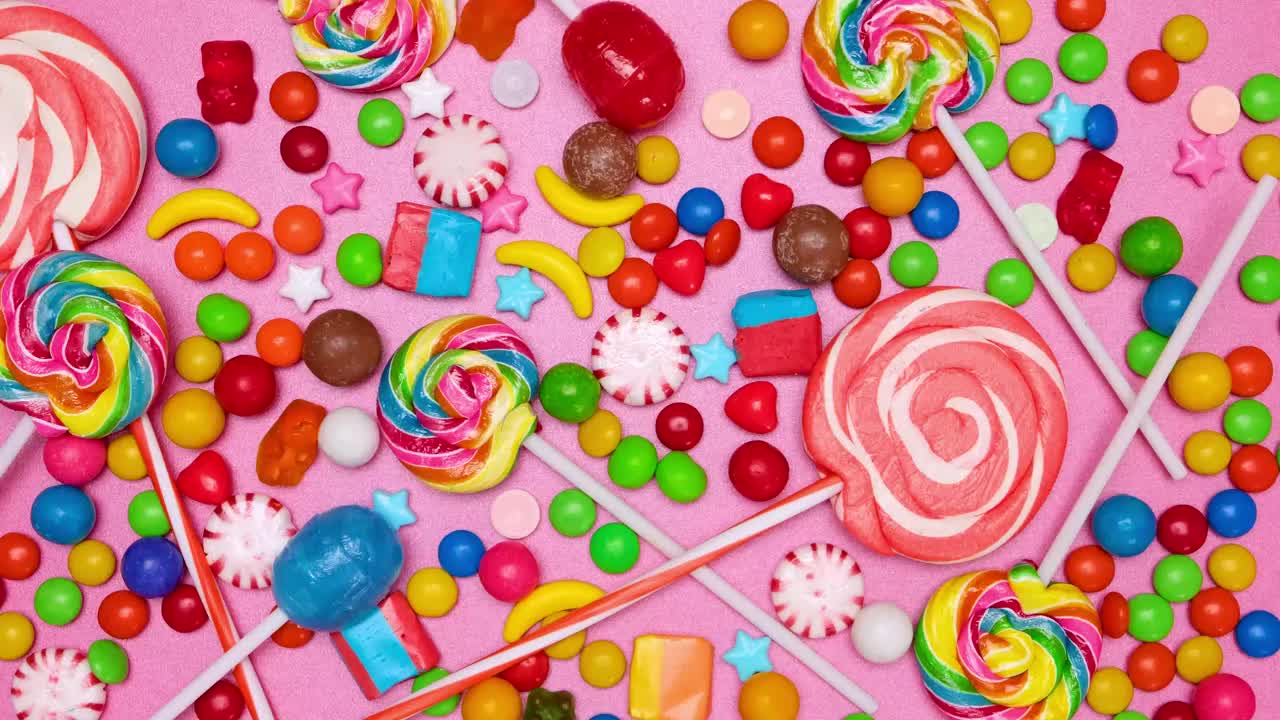 Stock Video Covering A Pink Background With Candies In Stop Motion Live Wallpaper For PC