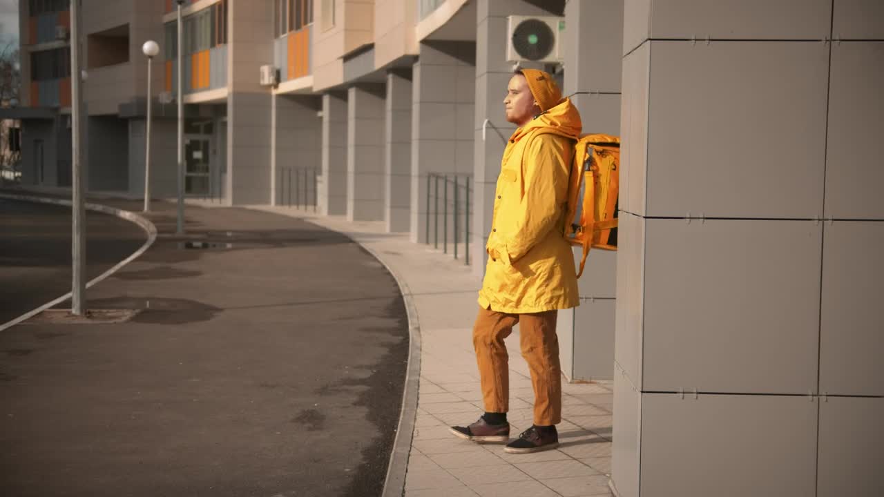 Stock Video Courier Man With Backpack Searching For Delivery Address Live Wallpaper For PC