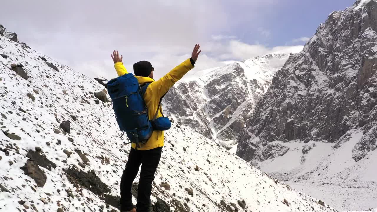 Stock Video Courageous Hiker Spreads Arms Over Mountain Summit Live Wallpaper For PC
