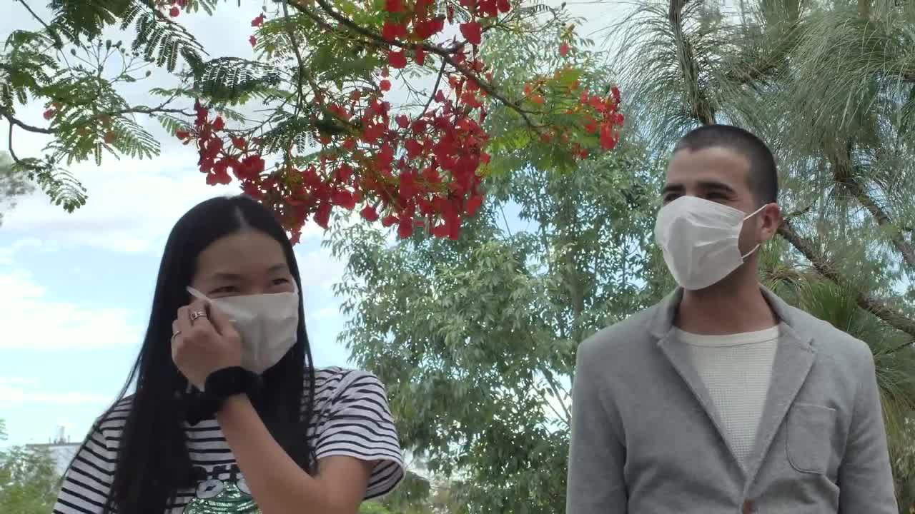 Stock Video Couple With Masks Walking In A Park Live Wallpaper For PC