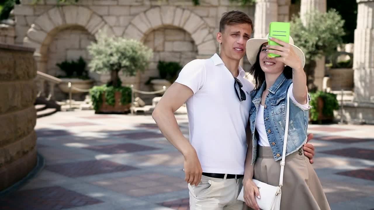 Stock Video Couple Taking Selfies During A Walk Live Wallpaper For PC