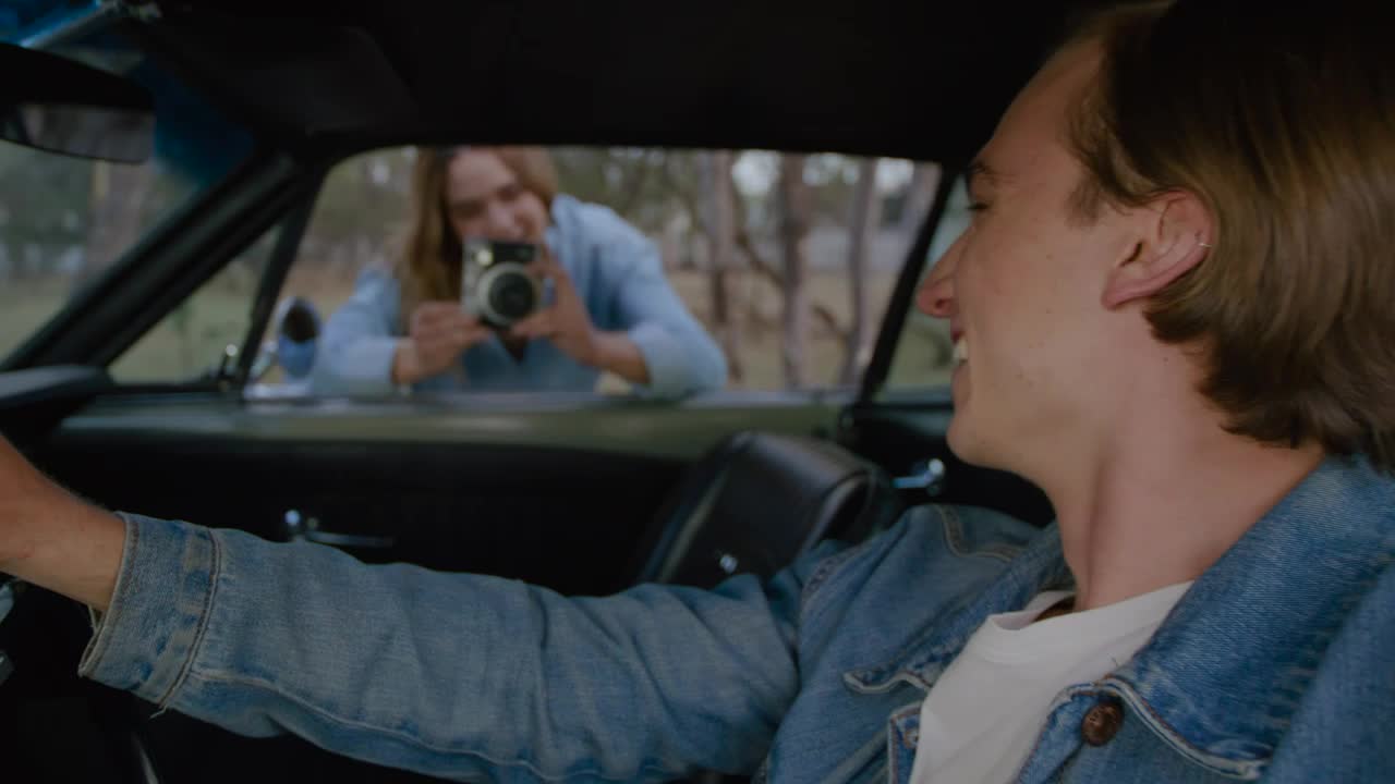 Stock Video Couple Taking Photos During A Road Trip Live Wallpaper For PC
