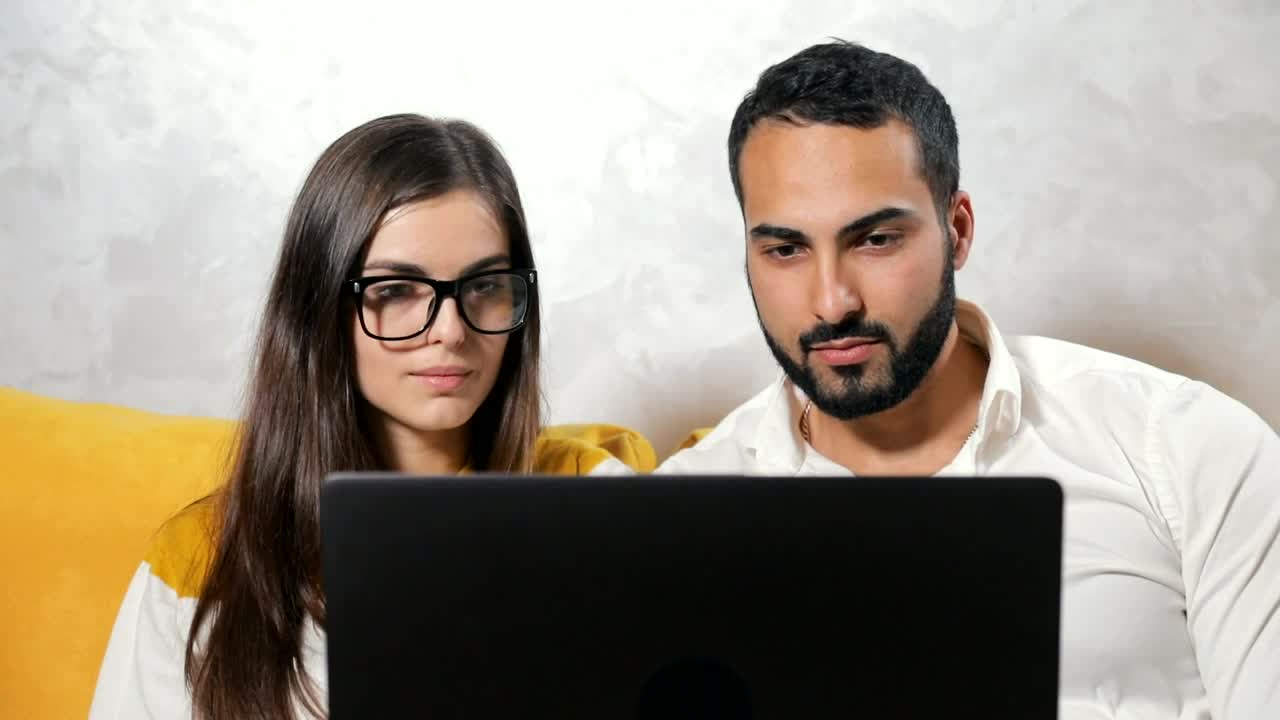 Stock Video Couple Surprised By What They See On Their Laptop Live Wallpaper For PC