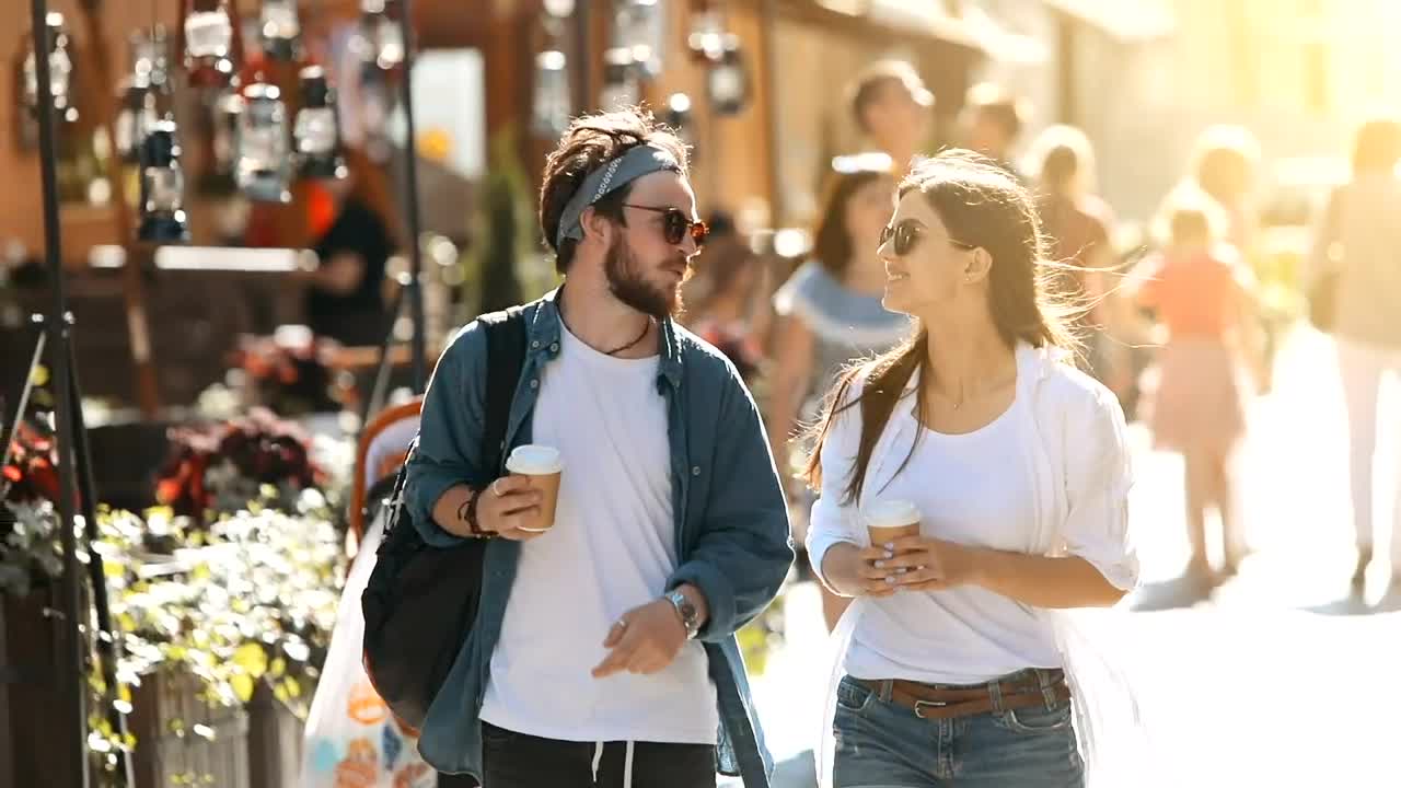 Stock Video Couple Stroll Down Sunny Street With Coffee Live Wallpaper For PC