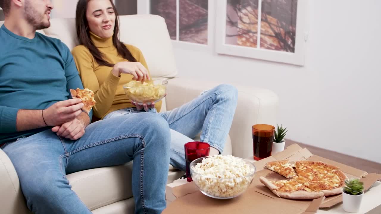 Stock Video Couple Sharing A Pizza And Popcorn Live Wallpaper For PC