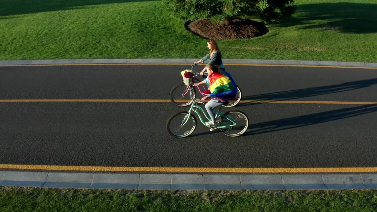 Stock Video Couple Riding Bikes Down An Empty Road Live Wallpaper For PC