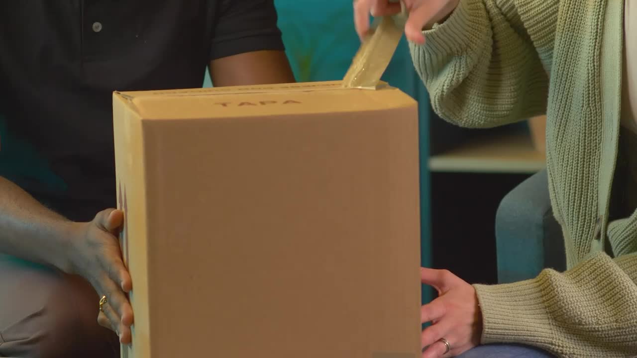 Stock Video Couple Opening A Package With An Alarm Clock Live Wallpaper For PC