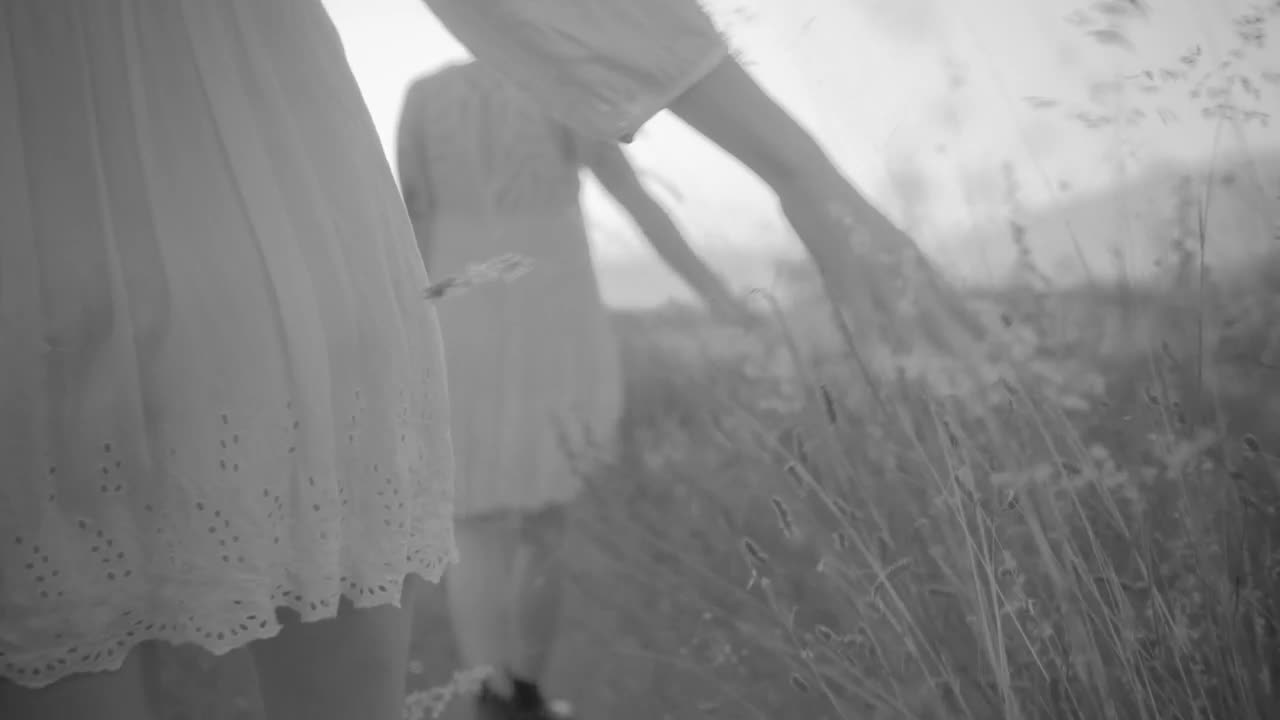 Stock Video Couple Of Women Dressed In White Walking Across The Field Live Wallpaper For PC