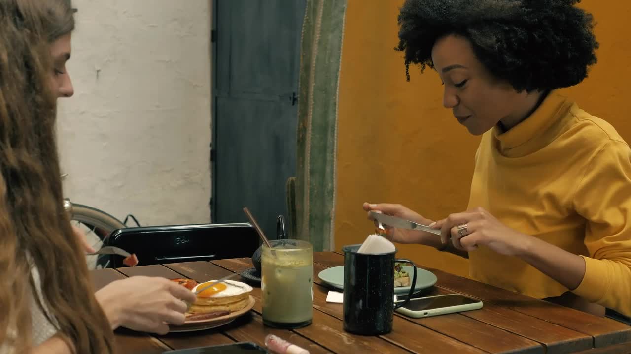 Stock Video Couple Of Girls Having Breakfast Together In A Restaurant Live Wallpaper For PC