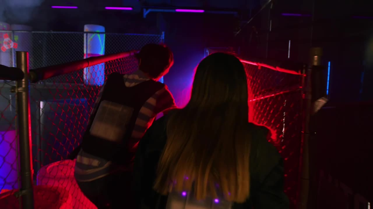 Stock Video Couple Of Friends Having Fun Playing Laser Tag Live Wallpaper For PC