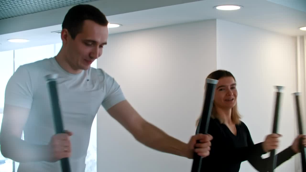 Stock Video Couple Of Friends Doing Cardio Exercise In The Gym Live Wallpaper For PC