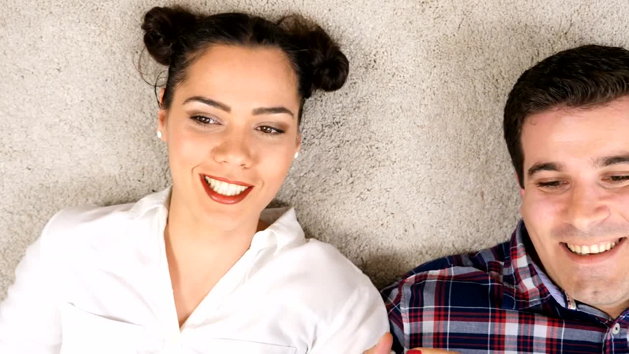 Stock Video Couple Lying On The Carpet Laughing And Talking Live Wallpaper For PC