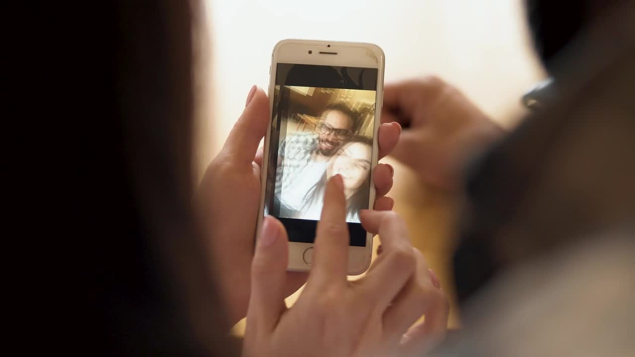 Stock Video Couple Looking At Selfies In Their Cell Phone Live Wallpaper For PC