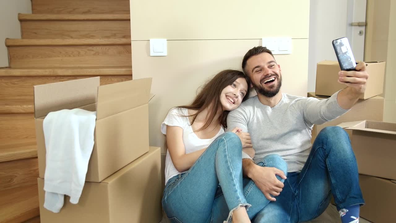 Stock Video Couple In Jeans Take Selfies In New Apartment Live Wallpaper For PC