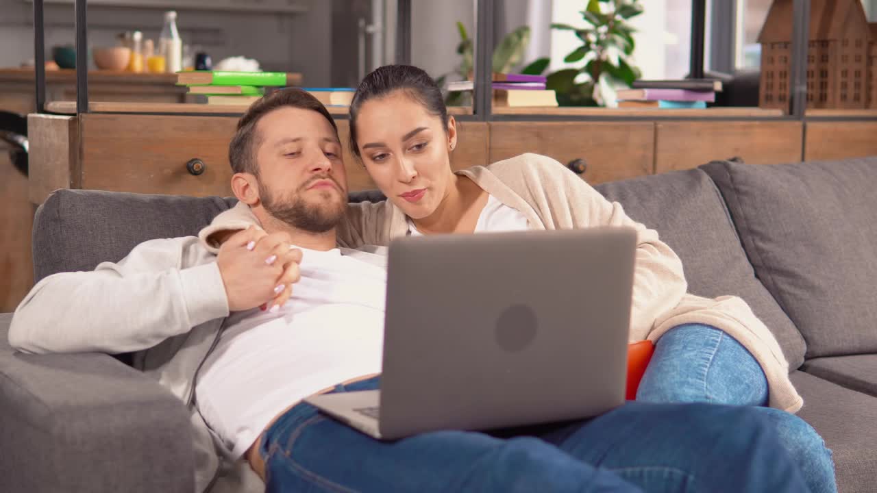 Stock Video Couple Holding Each Other In An Armchair Watching A Movie Live Wallpaper For PC
