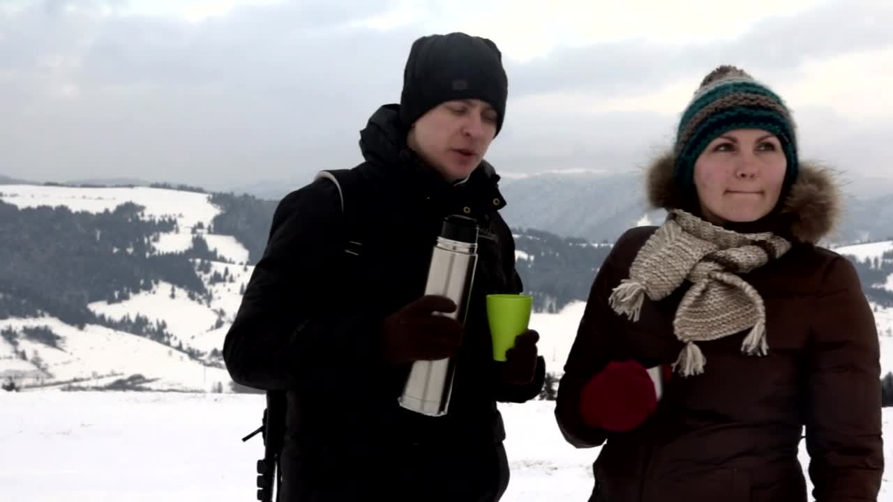 Stock Video Couple Having Tea In A Snowy Mountain Landscape Live Wallpaper For PC