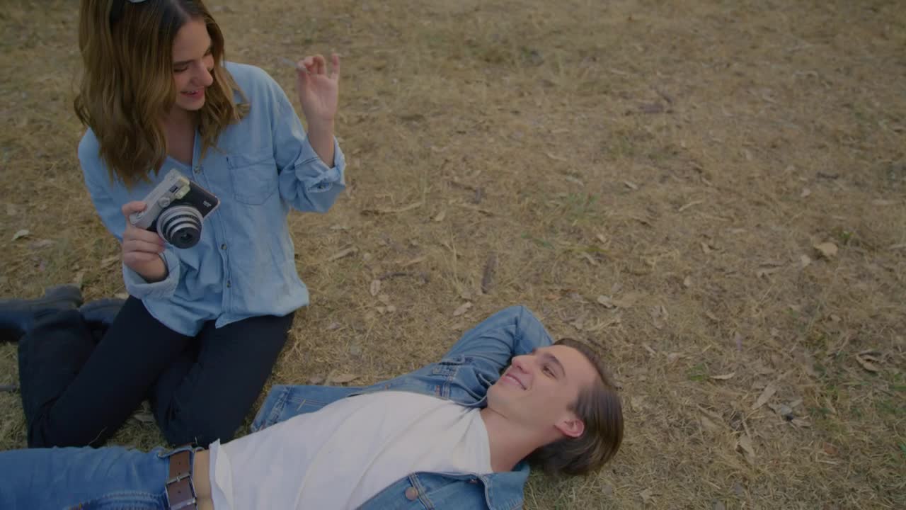 Stock Video Couple Having Fun With A Polaroid Camera Live Wallpaper For PC