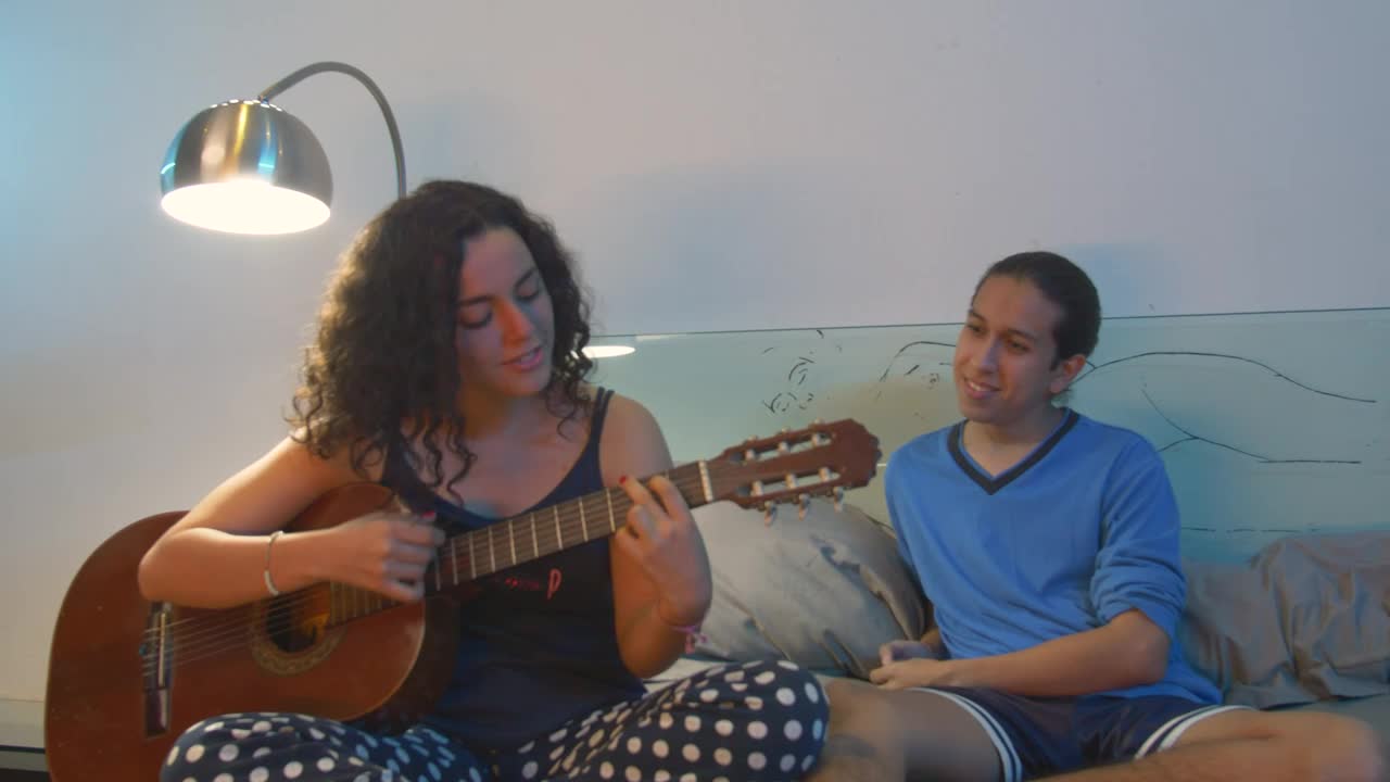 Stock Video Couple Hanging Out While She Plays Guitar Live Wallpaper For PC