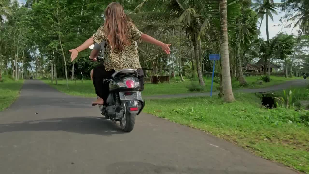 Stock Video Couple Enjoying A Scooter Ride On Their Vacation Live Wallpaper For PC