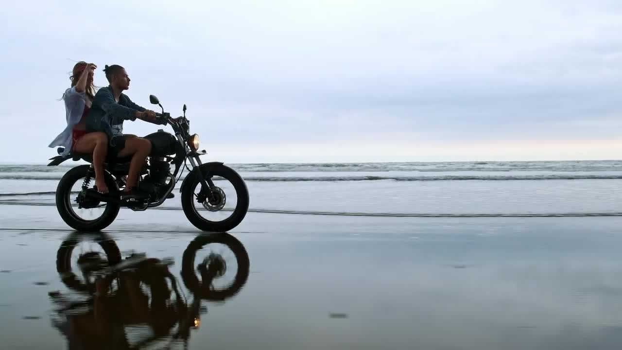 Stock Video Couple Enjoying A Motorcycle Trip On Their Beach Vacation Live Wallpaper For PC